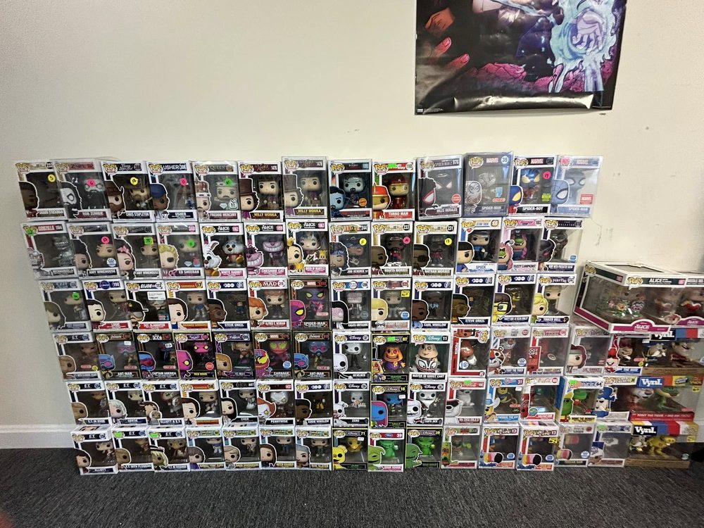 Wall of boxed Funko Pop figures stacked several rows deep